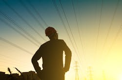 Electrical engineer looking sunset Electrical engineer looking sunset