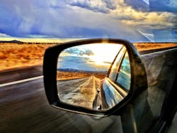 Window and mirror view on the road in the American Southwest. Window and mirror view on the road in the American Southwest.
