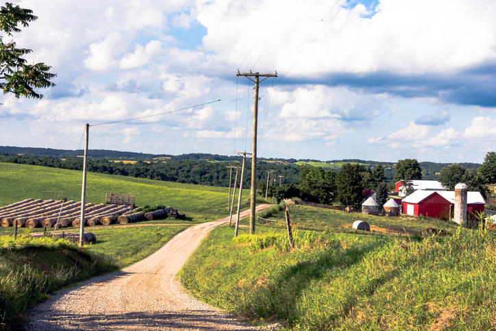 Country road leading next to a farm in rural Ohio