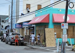 Workers board up shops Workers board up shops