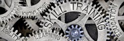 Macro photo of tooth wheel mechanism with SKILL TRAINING, EDUCATION, LEARNING, ABILITY, KNOWLEDGE and COMPETENCE words imprinted on metal surface Macro photo of tooth wheel mechanism with SKILL TRAINING, EDUCATION, LEARNING, ABILITY, KNOWLEDGE and COMPETENCE words imprinted on metal surface