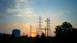 A view of the electrical towers and industrial storage tanks at sunrise in Sayerville NJ.
