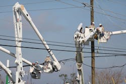 Workers repair the electrical grid Workers repair the electrical grid