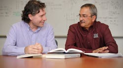 NMSU computer science department head Enrico Pontelli, left, and electrical and computer engineering department head Satishkumar Ranade meet to discuss their Smartgrid research.