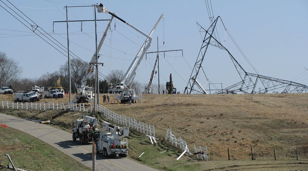 TVA construction crews work on tower and pole structure restoration of tornado damage in 2011.