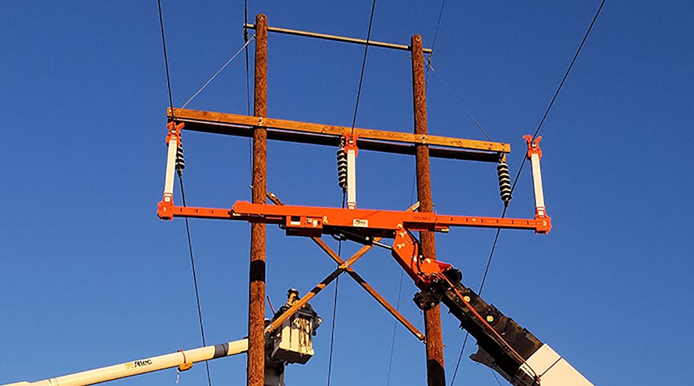 Linemen Handle Energized Conductors With Insulated Line Lifter | T&D World