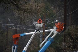 PARADISE, CALIFORNIA - NOVEMBER 21: Pacific Gas and Electric (PG&E) crews repair power lines that were destroyed by the Camp Fire PARADISE, CALIFORNIA - NOVEMBER 21: Pacific Gas and Electric (PG&E) crews repair power lines that were destroyed by the Camp Fire