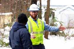Duke Energy employee Dustin Richardson talks to a customer during power restoration efforts in Warren County, N.C. Duke Energy employee Dustin Richardson talks to a customer during power restoration efforts in Warren County, N.C.
