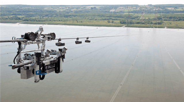 The LineScout robot, by MIR Innovation, a subsidiary of Hydro-Qu&eacute;bec, inspects a ground wire and 735-kV lines near Ile d&rsquo;Orl&eacute;ans in the Saint Lawrence River, east of downtown Qu&eacute;bec City, Qu&eacute;bec, Canada. Photo credit: Hydro-Qu&eacute;bec