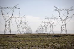 Power lines carrying electricity from the Golmud Solar Park hang from transmission towers on the outskirts of Golmud, Qinghai province, China, on Wednesday, July 25, 2018. China has emerged as the global leader in clean power investment after it spent $127 billion in renewable energy last year as it seeks to ease its reliance on coal and reduce smog in cities, according to a report jointly published by the United Nations and Bloomberg New Energy Finance in April. Photographer: Power lines carrying electricity from the Golmud Solar Park hang from transmission towers on the outskirts of Golmud, Qinghai province, China, on Wednesday, July 25, 2018. China has emerged as the global leader in clean power investment after it spent $127 billion in renewable energy last year as it seeks to ease its reliance on coal and reduce smog in cities, according to a report jointly published by the United Nations and Bloomberg New Energy Finance in April. Photographer: