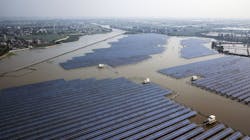 Photovoltaic panels stand at a solar farm operated by China Energy Conservation and Environmental Protection Group in this aerial photograph taken on the outskirts of Jiaxing, Zhejiang province, China. Photovoltaic panels stand at a solar farm operated by China Energy Conservation and Environmental Protection Group in this aerial photograph taken on the outskirts of Jiaxing, Zhejiang province, China.