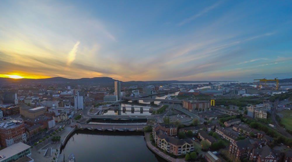 Aerial view on river and buildings in belfast northern ireland. Sunset over city
