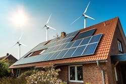Solar panel on a roof with wind turbines in the background Solar panel on a roof with wind turbines in the background