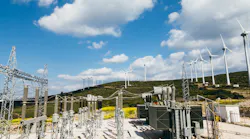 Power substation and wind turbines generate renewable green energy