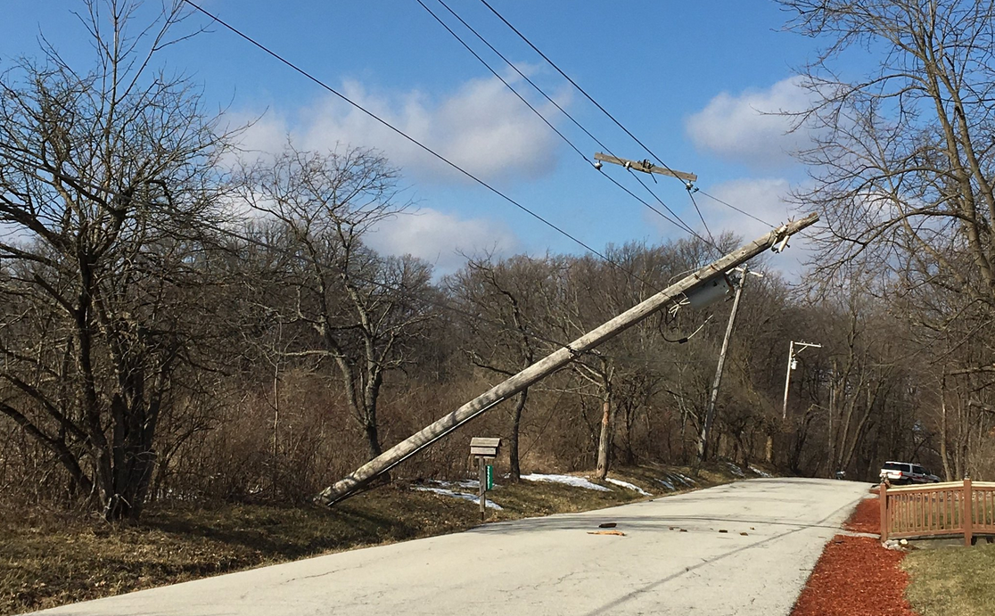 An electricity pole keeling over