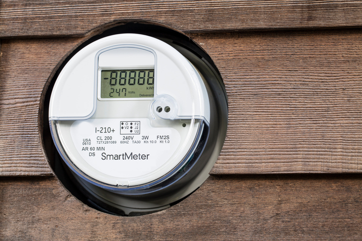 A smart meter with its screen showing readings