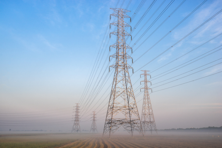 Electric poles on a foggy morning