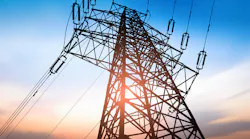 Electric transmission tower and overhead lines