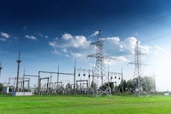 An electric substation and overhead transmission lines An electric substation and overhead transmission lines
