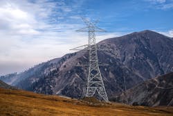 Electric transmission tower on mountainous terrain Electric transmission tower on mountainous terrain