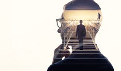 A man on a flight of stairs superimposed on silhouette of a thinking man A man on a flight of stairs superimposed on silhouette of a thinking man