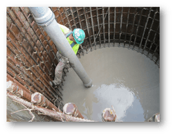 Workers working on transmission line across river valley Workers working on transmission line across river valley