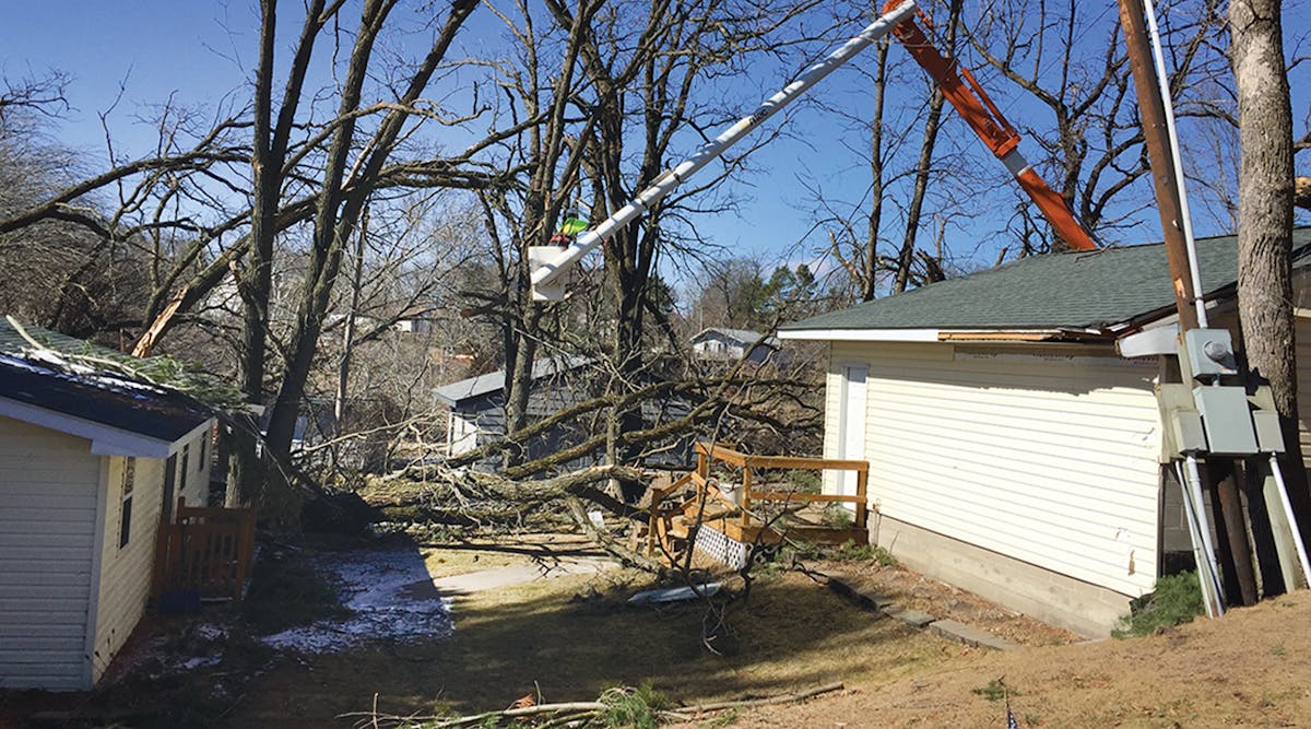 Some outages are hard to predict based only on tree trimming cycle lengths. On March 6, 2017, the earliest confirmed tornados in Minnesota history touched down, causing tree and pole damage on the Connexus Energy system near the town of Zimmerman. This was immediately followed by about 6 inches of snow, subfreezing temperatures and 30-mph winds with even larger gusts, making damage removal difficult at first for this Asplundh lift crew assisting with power restoration.