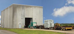 A standard semi-truck delivering a unit of the rapid recover transformer pulls into the tornadoproof, custom-designed storage facility.