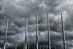 storm behind power lines storm behind power lines