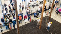 Linemen provide a demonstration after the new NES training center opens its doors on the north side of Nashville, Tennessee.