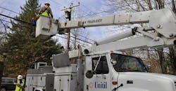 Workers replacing faulty electrical equipment Workers replacing faulty electrical equipment