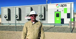 APS' director of Technology Innovation stands in front of APS' energy storage battery APS' director of Technology Innovation stands in front of APS' energy storage battery