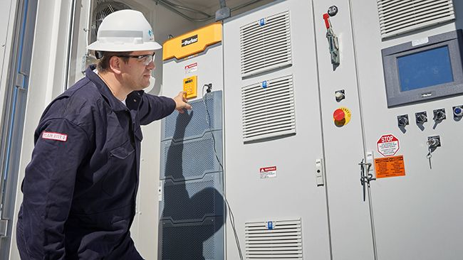 A man operating a battery storage unit