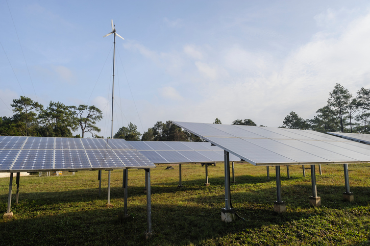 A wind turbine and a range of solar panels