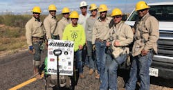 Helms met this line crew while traveling in Texas Helms met this line crew while traveling in Texas