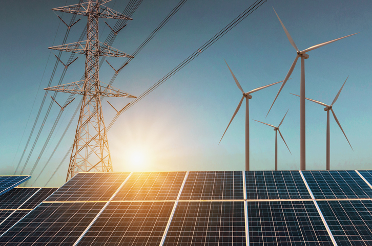 Solar panels, wind turbines, electric transmission tower and overhead lines