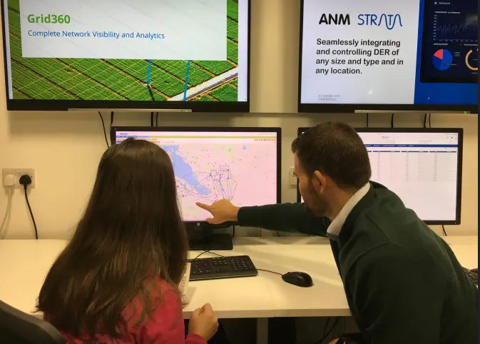 People discussing data on a computer