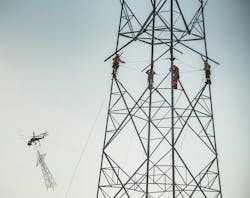 Helicopter erection of self-supporting tower Helicopter erection of self-supporting tower