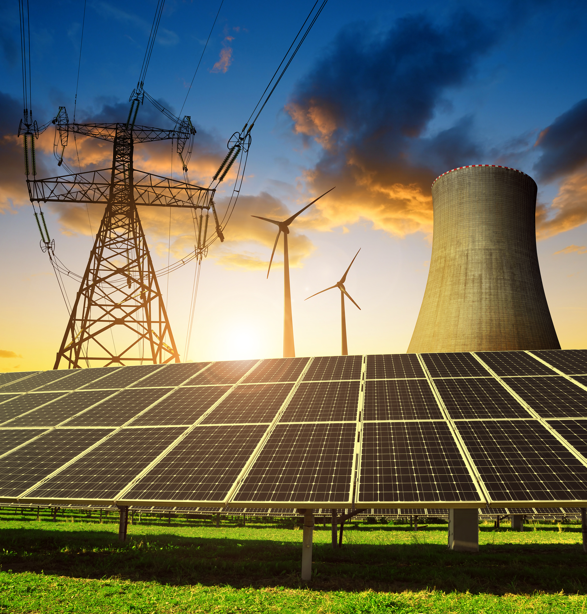 Solar panels, wind turbines, electric transmission tower, overhead lines and a power plant chimney