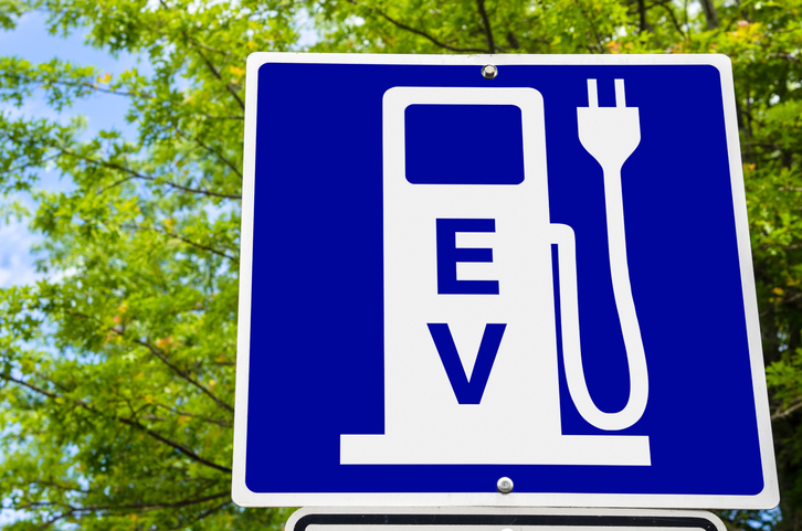 A signboard showing an EV charger