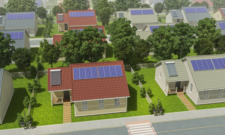 Houses with solar panels on roofs