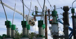 AEL&P line crew installing new Greenjacket product on a 69 kV disconnect switch AEL&P line crew installing new Greenjacket product on a 69 kV disconnect switch