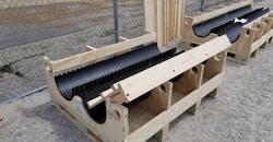 Cradle/jig concept used to assemble 765-kV dead ends on ground and insert custom spreader bar.