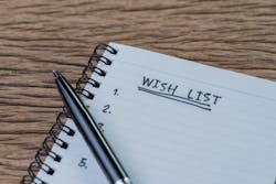 An open notebook with a pen on top An open notebook with a pen on top