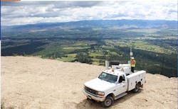 A truck with mountains in the background A truck with mountains in the background