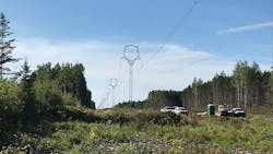 A summertime view of a completed section of the transmission line.