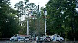 Utility trucks on a field
