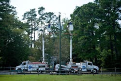 Utility trucks on a field Utility trucks on a field