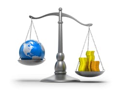 A weighing scale with a globe and coins on either arm A weighing scale with a globe and coins on either arm