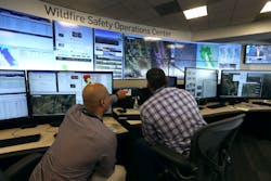 Men working in the PG&E operations center Men working in the PG&E operations center